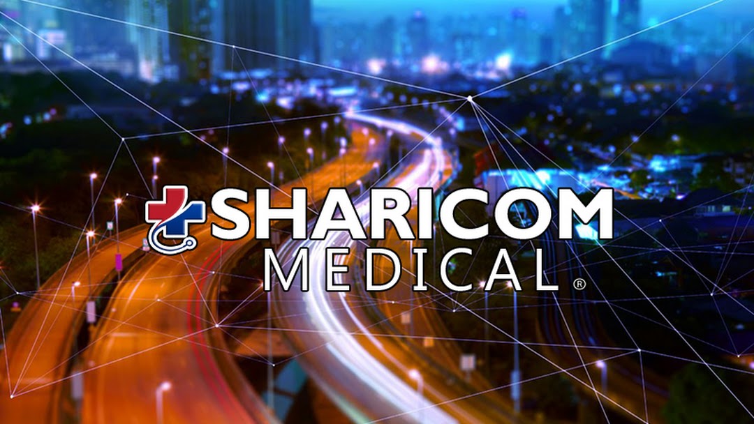 Sharicom Medical logo over a nighttime highway logistics scene